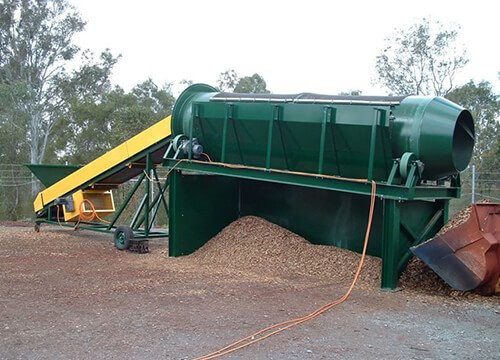 Puulastujen trommel-seula